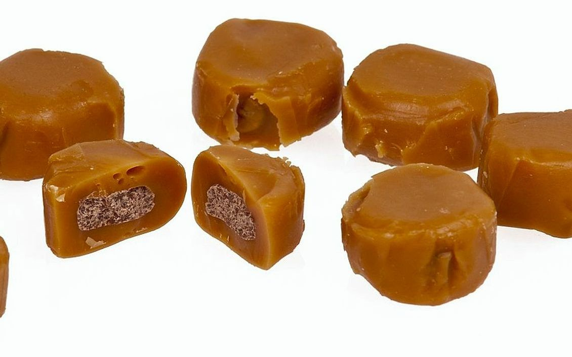 A plate of salted chocolate bonbons dusted with cocoa
